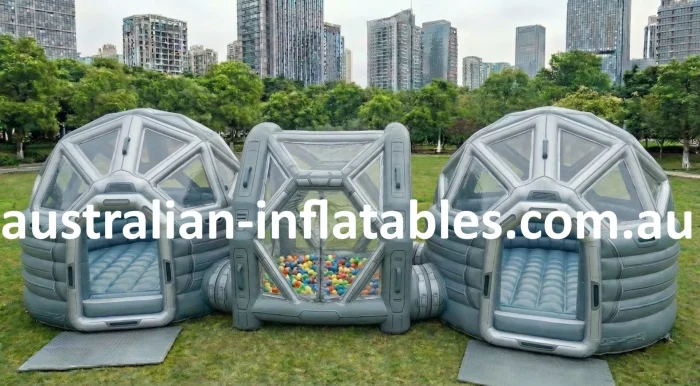 Galactic Zone 10m commercial jumping castle with ball pit, featuring a futuristic titanium grey inflatable design for Australian party hire businesses.